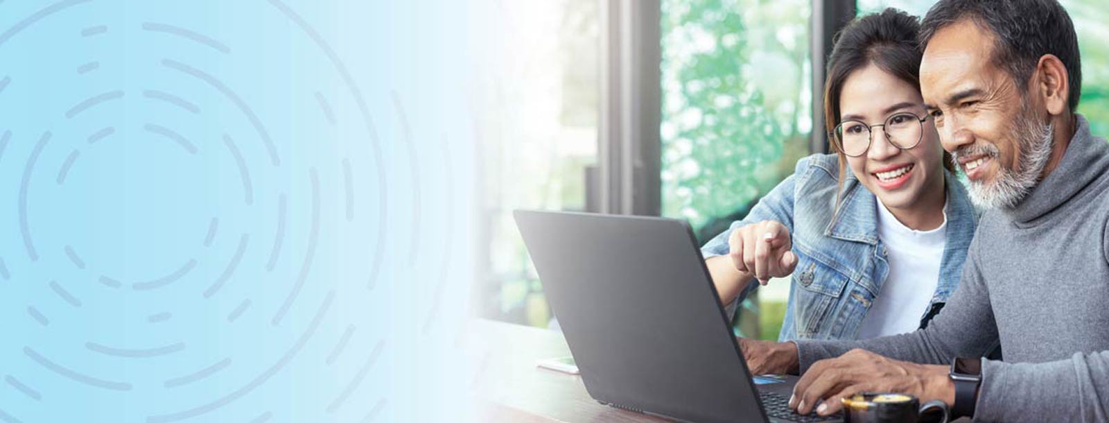 Two people on a computer